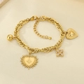 Close-up of 18K gold plated chain bracelet with heart, flower and bow charms detail - Zircon Flower Textured Heart Style (KB205156-SXSJ)