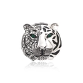 Silver tiger head brooch with green crystal eyes and black enamel details on white background - Silver