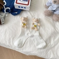 Cute white crew socks with 3D plush bear charms featuring a smiley face emblem - One Size / White