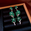 Detailed macro of green crystal flower tassel earrings in a black velvet jewelry box - 32# Green Flower Tassel (Silver Earring Post)