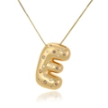 Macro shot of 18k gold plated chunky letter E pendant with sparkling zircon inlays - Letter E