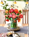 Detail of 3D pop-up greeting card featuring vibrant paper flowers in a blue floral vase - Dahlia B