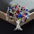 Colorful rhinestone tree brooch in silver alloy base on dark gray jewelry box display - Silver