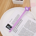Cute purple cartoon swan gel pen on a white decorative plate with an aesthetic background - Swan Purple