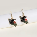 Gothic style raven and red rose earrings with detailed enamel finish on a display stand - Myna Black Red Rose Gothic