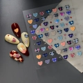 Detail of Co-154 embossed heart nail stickers with colorful plaid patterns on nails - Plaid Heart Style (CO-154)