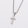 Macro detail of silver stainless steel cross pendant featuring JESUS engraving and box chain - With Chain / Steel