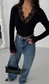 Close-up of black V-neck lace long sleeve top featuring intricate floral mesh details - S / Black