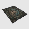 Macro detail of Tree of Life flannel blanket with Celtic knot design on black fabric - Black Tree of Life