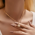 Elegant gold necklace featuring a shell-style pearl pendant with sparkling crystal trim - KN0454-Sun Rhinestone Pearl