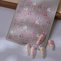 Dettaglio di adesivi per unghie aurora con fiocchi rosa, ciliegie e motivi di conigli - Stile Coniglio Dolce Rosa (CO-388)