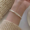 Minimalist double-layer silver beaded bracelet for women shown on wrist over a white sweater - Silver Double Layer Micro Bead (MY35294)