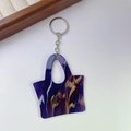 Detailed macro view of purple marble acrylic handbag keychain with silver metal ring - 5# Texture Blue