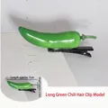 Detail view of 7cm green chili hair clip with realistic resin texture and metal clip - Long Green Chili