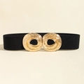 Detail of black elastic waist belt featuring a textured gold-tone double ring metal buckle - Black