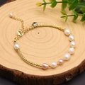 Gold-tone twisted chain bracelet featuring elegant white and pink freshwater pearls - Curved Tube Bracelet