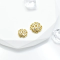 Golden filigree flower jewelry spacers with zircons on white minimalist stone stand - Style 6