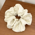 French retro champagne scrunchie in shimmering pearlescent fabric on wood background - Large / Off White