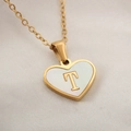 Elegant gold heart pendant necklace featuring a white shell inlay with letter T detail - Letter T