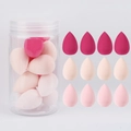 Detail view of 12 mini teardrop-shaped pink makeup sponges in a clear storage jar - 12Pcs Jar Rose Pink Nude