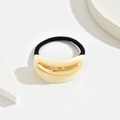 Dettaglio dell'elastico per capelli in acetato con inserto in metallo dorato su base - Albicocca