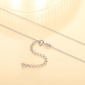 Detailed macro view of silver cross chain lobster clasp and adjustable droplet pendant - XL1187 Cross Chain