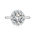 Silver oval cut halo ring with crystal cluster and polished slim band in a top view - Adjustable Open / White Zirconia