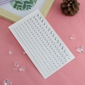 Iridescent butterfly teardrop face rhinestones on pink background for makeup decoration - Iridescent Linked Rhinestone Stickers