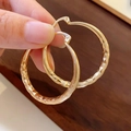 Detailed close-up of gold-plated hoop earrings with textured diamond-cut pattern finish - 26# Rhombus Carved Hoop (26# Huggie-Gold-Wave-Dia 39mm)