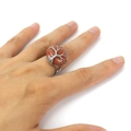 Detailed view of handmade tree of life ring with sparkling goldstone on hand - Gold Sandstone