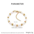 Dettaglio del bracciale con perle e sfere dorate 190x6mm con chiusura a moschettone - 6mm Oro (KB206995-Z)