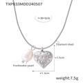 Zilveren slangenketting met zoetwaterparel en getextureerde stalen hartvormige hanger - Zilveren Ketting