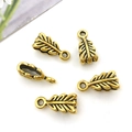 Five golden feather metal alloy charms for jewelry making on a clean white background - 14341-Gold Feather Shape