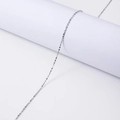 Minimalist silver stainless steel thin necklace chain displayed on white minimalist props - 45+5cm / 1.3mm Starry Chain / Steel