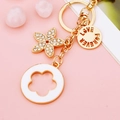 Golden flower keychain with white enamel charm and Love Forever engraved metal pendant - White Five-leaf Clover