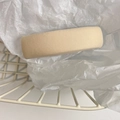 Close-up of beige fabric headband with twill texture in a rustic metal basket - Apricot