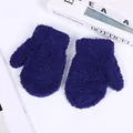 Detailed close-up of dark blue coral fleece winter mittens for children on a white desk - S / Navy Blue