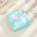 Elegant square jewelry gift box in turquoise blue with white silk bow ribbon decoration - Sky Blue