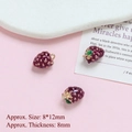 Detail of 8x12mm gold-plated raspberry pendant with red enamel and green leaf - Grapes