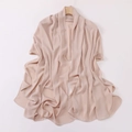Detail showing the light pink chiffon fabric with delicate pleats and soft texture - Nude