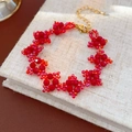 Detailed view of red beaded flower bracelet with adjustable chain on linen book surface - Red Beaded Bracelet (3#)
