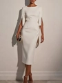 Close-up of elegant white dress featuring sophisticated pearl embellishments on slit cuffs - S / White