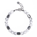 Close-up of 8mm white turquoise beads with stainless steel lobster clasp and heart tag - Howlite