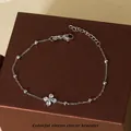 Elegant silver titanium steel clover bracelet with zircon inlay and beaded chain detail - Silver Clear Zircon Clover