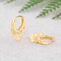 Polished gold huggie hoop earrings with multiple hanging star charms in a trendy style - Gold Star Pendant