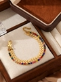Macro shot of double-layered gold chain bracelet featuring colorful rhinestones and V-shapes - Gold Double Layer Multicolor Rhinestone V-Chain Bracelet