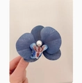 Elegant blue orchid hair clip with white pearl detail for women in a side view - Stream Blue Orchid