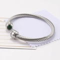 Silver cable wire bangle with a round green zircon stone in a polished finish - May/Green