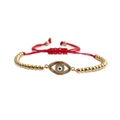 Pulsera étnica Ojo Turco con cuentas doradas y cordón rojo trenzado ajustable - Cuerda Roja Con Cuentas De Cobre