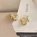 Irregular golden metal stud earrings with molten lava design on minimalist card - Gold